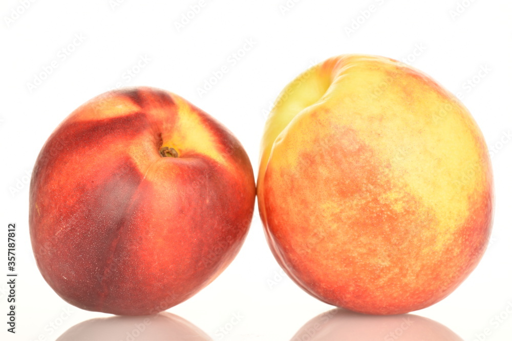 Ripe juicy organic nectarine, macro, on a white background. Ripe juicy organic nectarine, macro, on a white background.