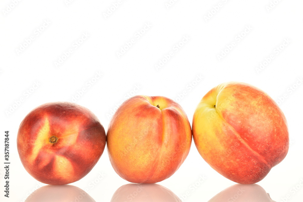 Ripe juicy organic nectarine, macro, on a white background. Ripe juicy organic nectarine, macro, on a white background.
