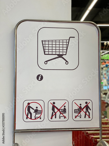 Pictogram instruction of how to ride child on shopping cart