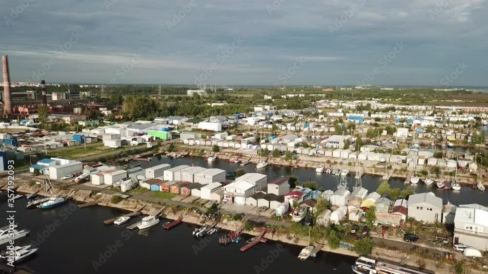 4K summer late afternoon aerial video of Baltic Sea Finnish Bay lagoon, Saint Petersburg boat parking yacht club area, boats and calm water surface in the northern capital of Russia 4K summer late afternoon aerial video of Baltic Sea Finnish Bay lagoon, Saint Petersburg boat parking yacht club area, boats and calm water surface in the northern capital of Russia