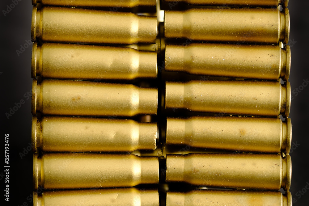 bullet shell cartridges on a black background closeup view bullet shell cartridges on a black background closeup view