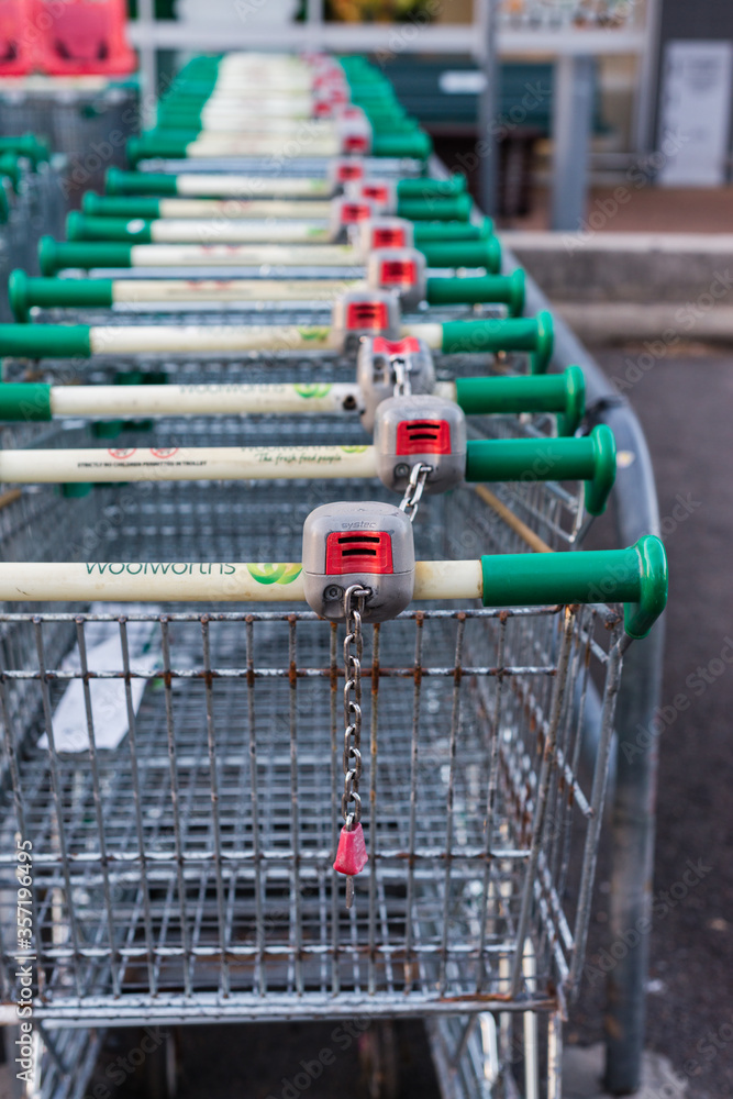 Woolworths trolley with coin operated security feature Stock Photo | Adobe  Stock