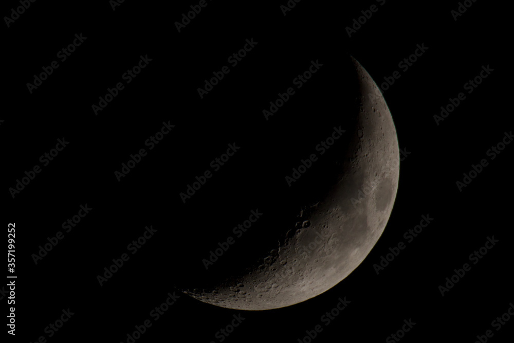 Fototapeta premium Moon with visible shadows in craters.