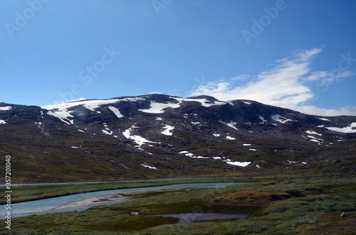 Views from the train window. Mountain tundra of Central Norway. Railway travel in Norway.The Bergen - Oslo train. © Sergey Kamshylin