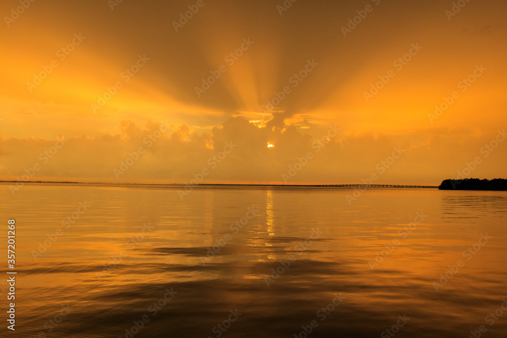 Golden sunrays at sunset over the Bay