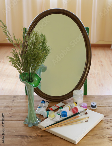 still life with a mirror and artist's paints