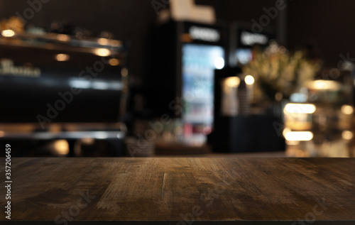 Wood Table Top in Blur Background room interior with empty copy space. © Charlie's