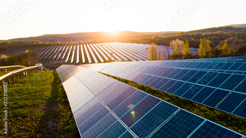 Solar panels (solar cell) in solar farm with sun lighting to create the clean electric power photo