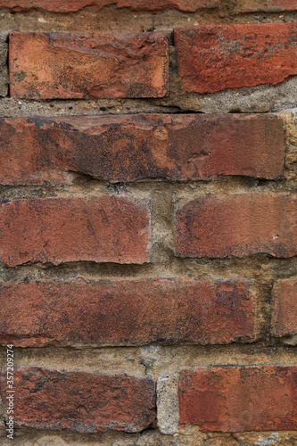 detail of very old red brick wall