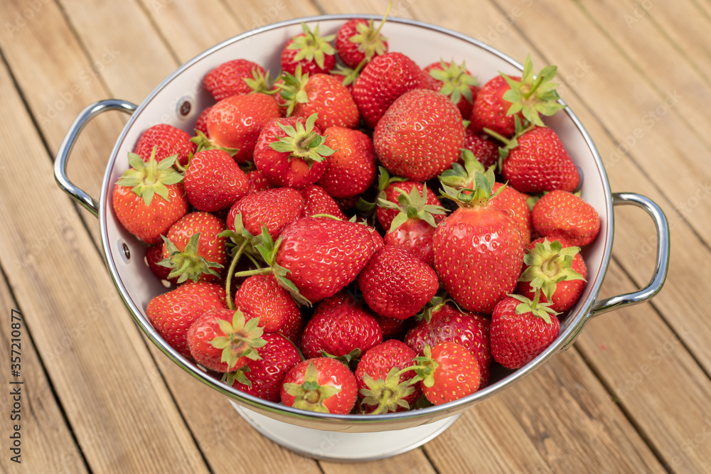 Strawberry in a Bowl on wooden background Strawberry in a Bowl on wooden background