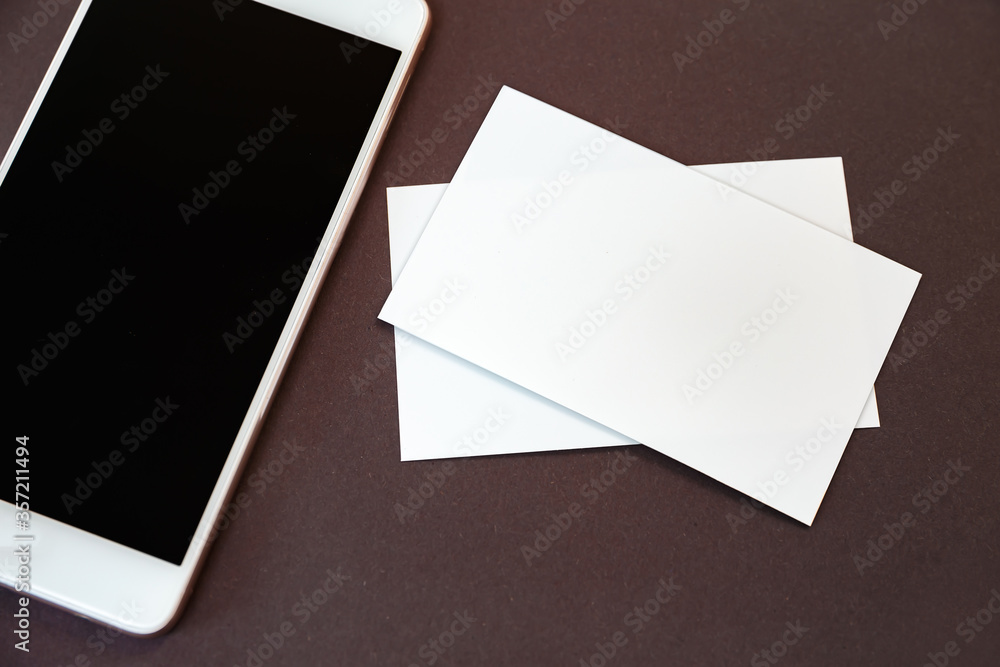 Mock up of blank business card and smartphone Mock up of blank business card and smartphone