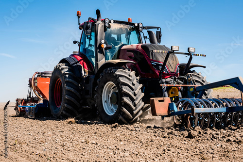 farmer in his tractor sowing in the fields