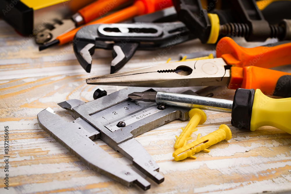 Different tools on the old background. Different tools on the old background.
