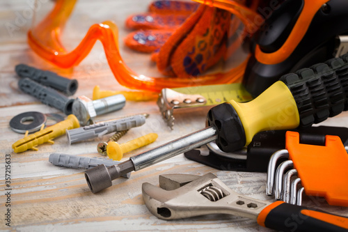 A home craftsman's tool for repairing household appliances and equipment. Arranged in a composition on old boards.