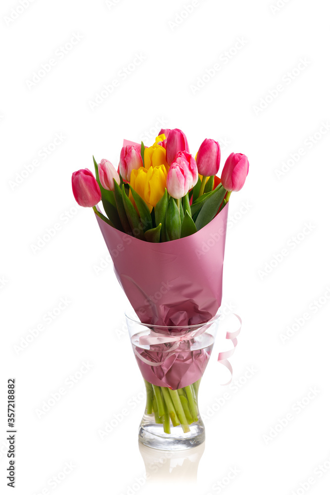 tulip flowers bouquet in a glass vase, isolated on white