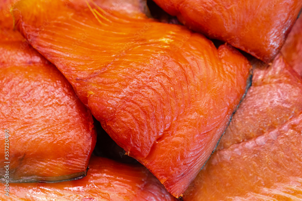Close up view of piece cold smoked salted Pacific red fish Chinook Salmon. Prepared and ready-to-eat Pacific seafood. King Salmon - Asian delicacy cuisine as an appetizer for any garnish, festive dish Close up view of piece cold smoked salted Pacific red fish Chinook Salmon. Prepared and ready-to-eat Pacific seafood. King Salmon - Asian delicacy cuisine as an appetizer for any garnish, festive dish