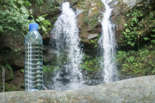 bottle of water in the forest