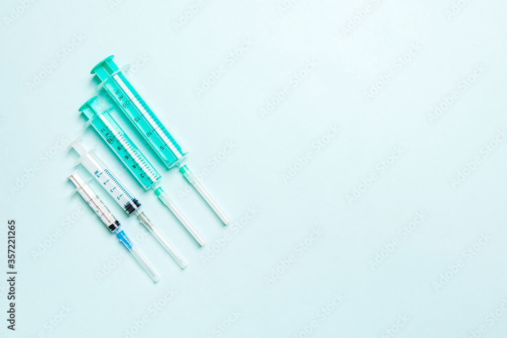 Top view of medical syringes on colorful background. Health care concept with copy space Top view of medical syringes on colorful background. Health care concept with copy space