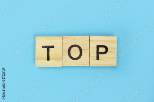 Top word of wooden letters on a blue background