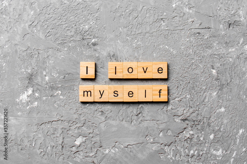 I Love myself word written on wood block. I Love myself text on cement table for your desing, concept