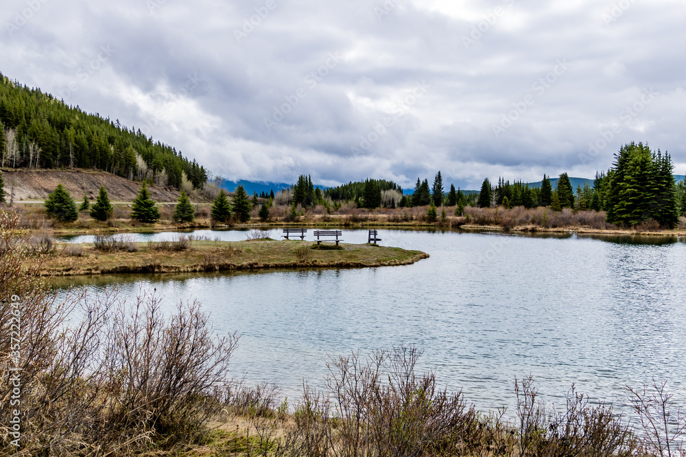 The still waters of Elk Pond. Elk Creek Fish Pond Provincial Recreation Area, Alberta, Canada The still waters of Elk Pond. Elk Creek Fish Pond Provincial Recreation Area, Alberta, Canada