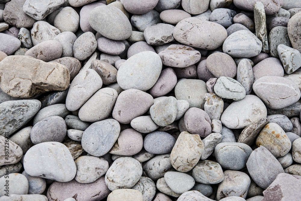 Grey pebbles stone for background. Close up. Grey pebbles stone for background. Close up.