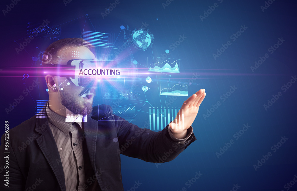 Businessman looking through Virtual Reality glasses with ACCOUNTING inscription, new business concept Businessman looking through Virtual Reality glasses with ACCOUNTING inscription, new business concept