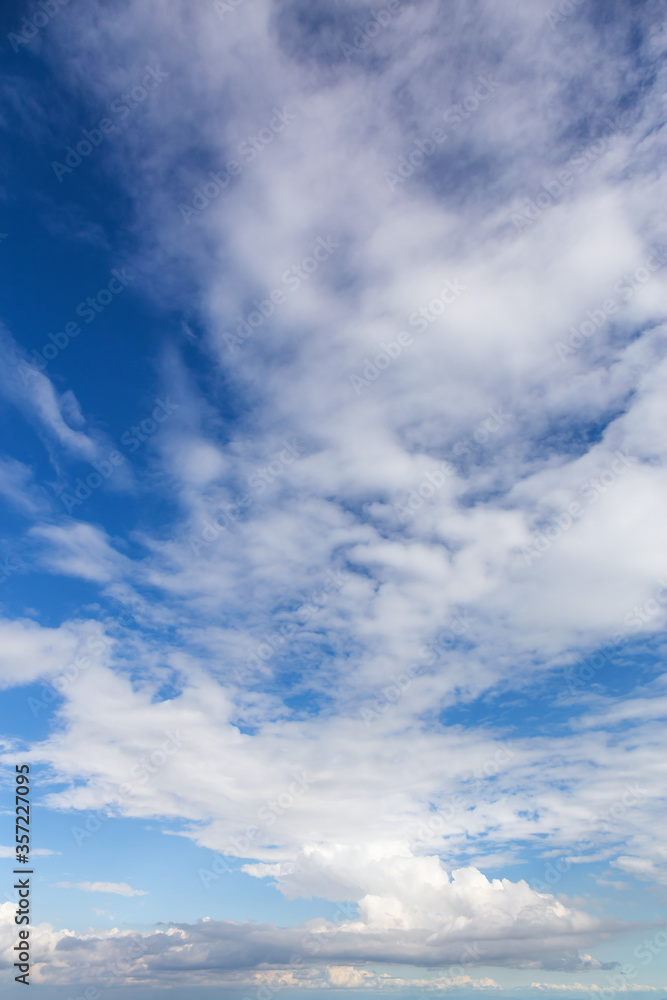 View of Puffy White Clouds with Blue Sky during a beautiful Sunny Day. Taken over Vancouver, British Columbia, Canada.
