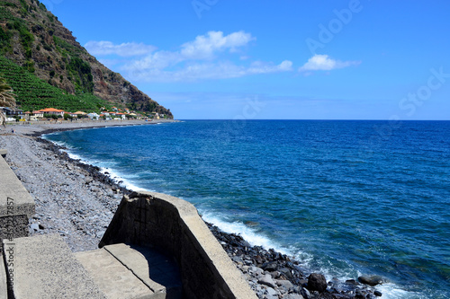 The view down the beach in Madalena do Mar in Madeira, Portugal photo