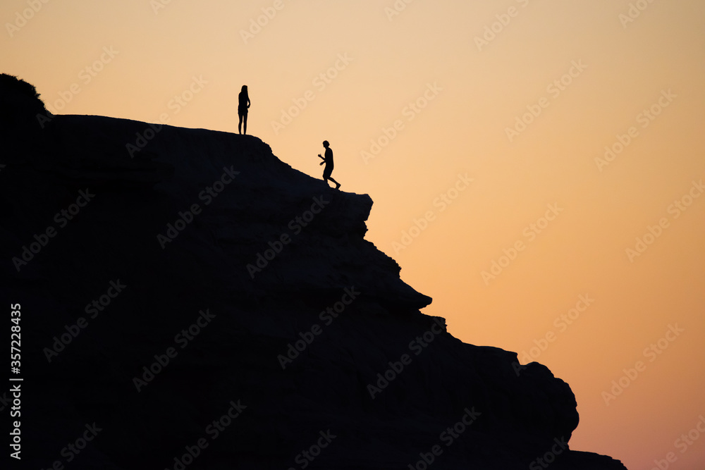An active couple enjoying the sunset at Maslin Beach near Adelaide, South Australia.
