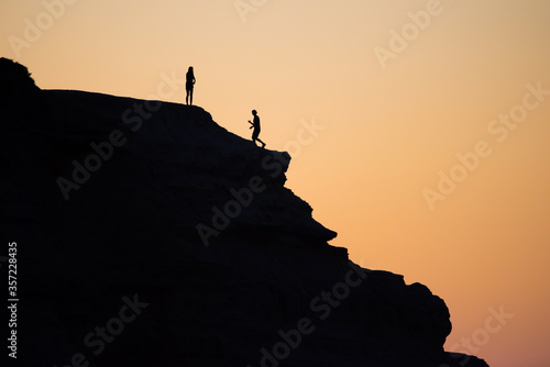 An active couple enjoying the sunset at Maslin Beach near Adelaide  South Australia.