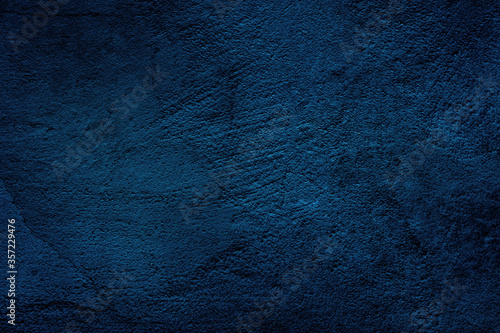 Wall texture dark blue. Abstract grunge dark navy blue textured background.