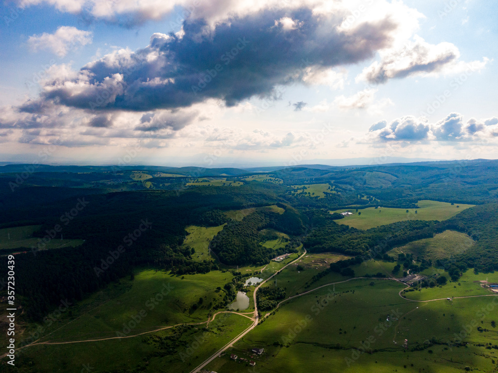Obraz premium Aerial photos of a field plus some beautiful clouds