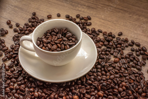 roasted coffee beans, mugs,wood background