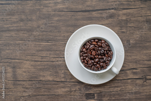 roasted coffee beans, blure background and mug