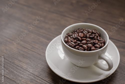roasted coffee beans, blure background and mug