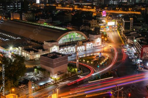 Illuminated main train station by night with traffic lights © Fototraveler