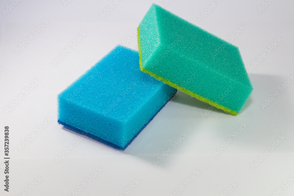 Sponge. Blue and green sponge. Sponge on a white background. Sponge. Blue and green sponge. Sponge on a white background.