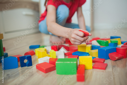 Children in the children's room play in colorful cubes. Cubes close up.