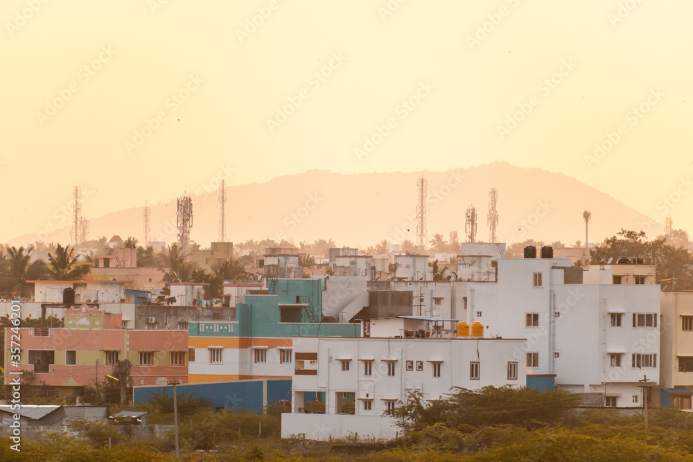 A low rise Chennai cityscape during golden hour