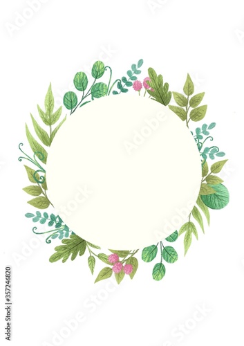 a circular frame of flowers and green plants