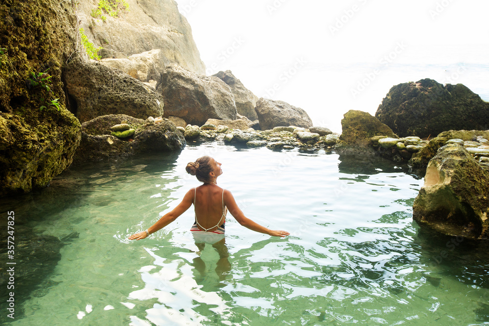 Fototapeta premium Beautiful woman in the nature pool