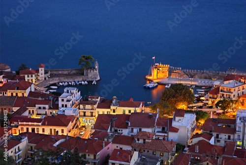 NAFPAKTOS TOWN, GREECE. Night view of the picturesque little port of Nafpaktos (Lepanto) town from its castle. Aitoloakarnania, Central Greece  photo