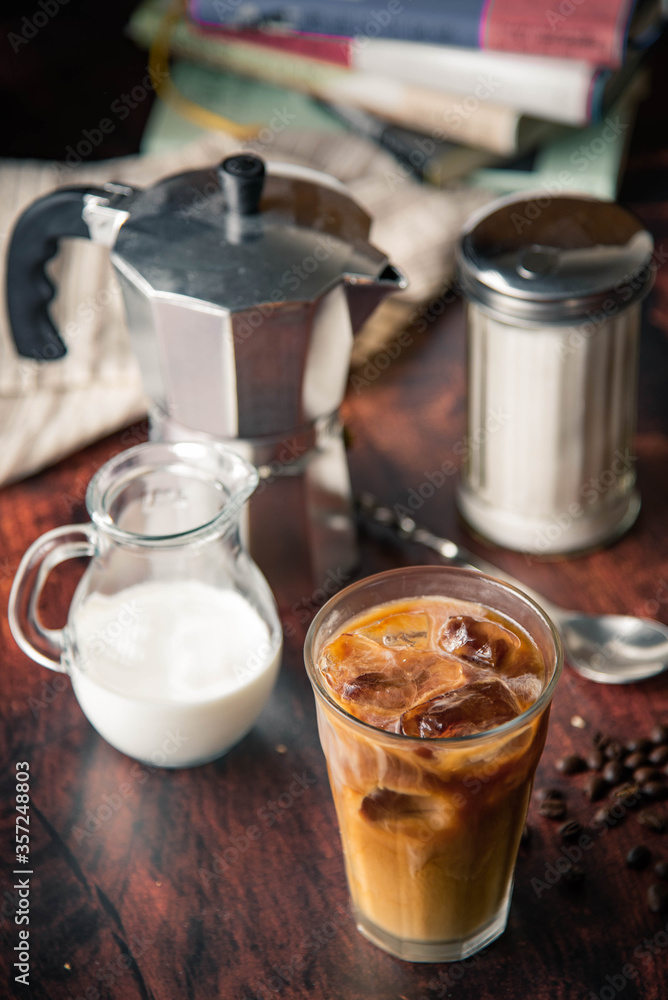 iced coffe with milk and book cafe background iced coffe with milk and book cafe background