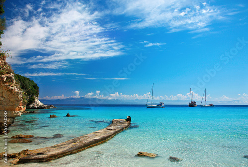 ANTIPAXOS ISLAND, CORFU ("KERKYRA") PREFECTURE, IONIAN SEA, GREECE. The small jetty at the exotic Voutoumi beach.