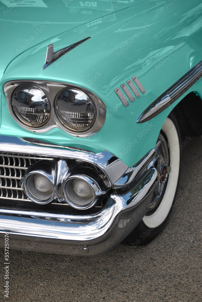 Grill and headlight of a vintage 1958 car beautifully restored.