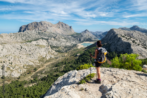 escursionista contemplando el valle de Binimorat y el Puig Major, Paraje natural de la Serra de Tramuntana, Mallorca, balearic islands, Spain photo