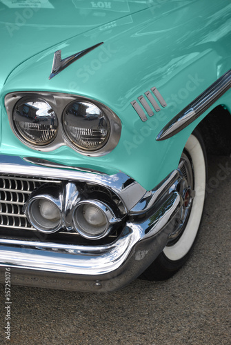 Grill and headlight of a vintage 1958 car beautifully restored.