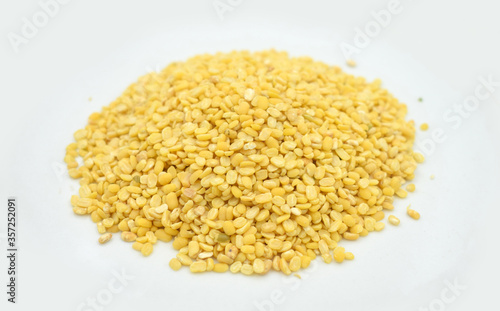 Yellow mung beans on white background