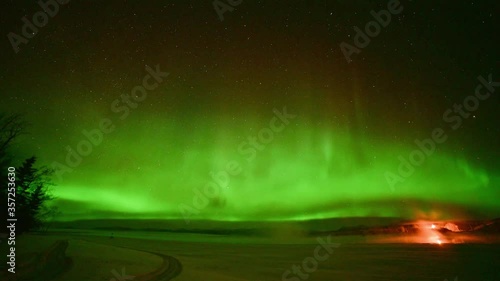 Wallpaper Mural Amazing Aurora Borelis, Northern Lights seen in Yukon Territory, northern Canada in cold winter season. Green sky, lit up with movement taken with time lapse over night time.  Torontodigital.ca